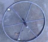 Black metal wheel approx 35cm with metal spike on both sides