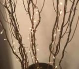 Brown metal vase with fairy light sticks (runs on power)