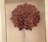 Orange Dried and framed floral arrangement