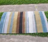 Wool rug in reasonable condition 85cm x 155cm