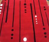 Red and black oval rug