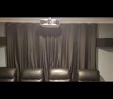 Black blockout curtains with rod and brackets