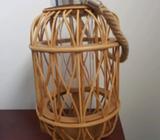Woven lantern with glass insert