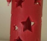 Red Christmas candle with star cutouts approx 10cm