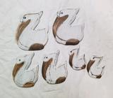 Carved wood pelicans