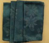 4 green napkins poinsettias pattern