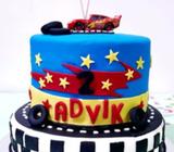 Lighting mcqueen and batman theme cake