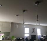 3 Glass and stainless pendant lights