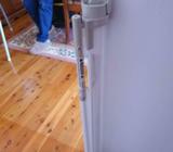 Auto retracting safety gate