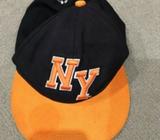 NY cap