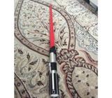 Red toy lightsaber used only once