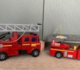 Two fire engines with movable ladders and water pumps