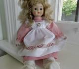 Vintage doll with apron