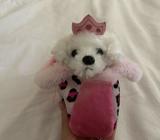Soft toy dog in a bag