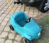 One green car with handle at the back to steer