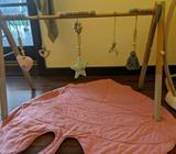 Wooden activity mobile with pink mat